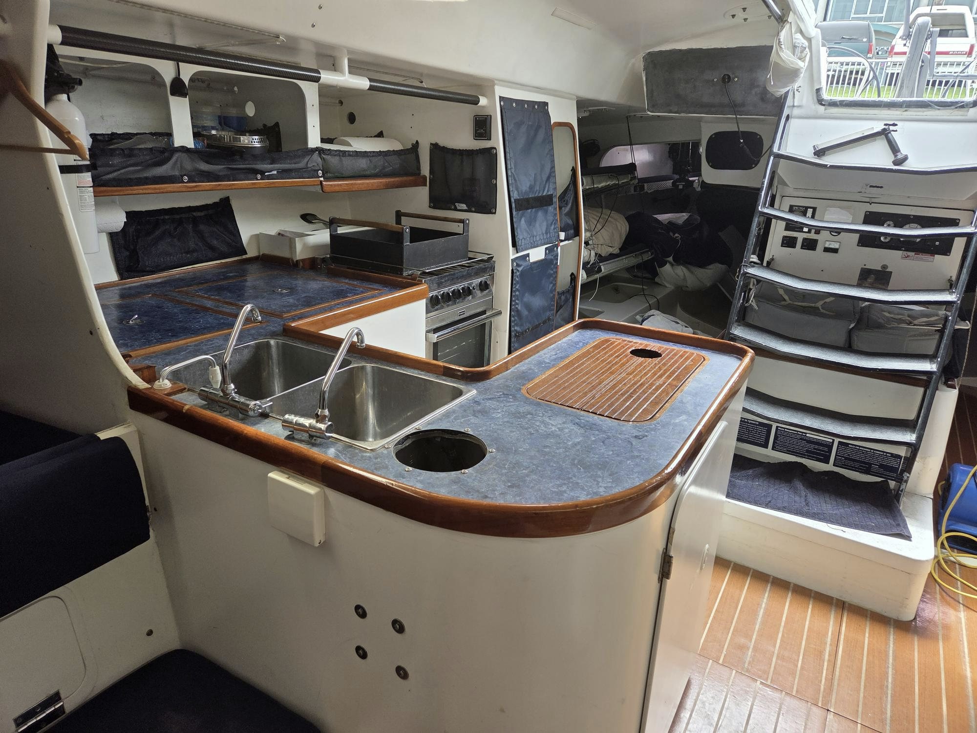 a kitchen with a stove and sink aboard PELIGROSO Yacht for Sale
