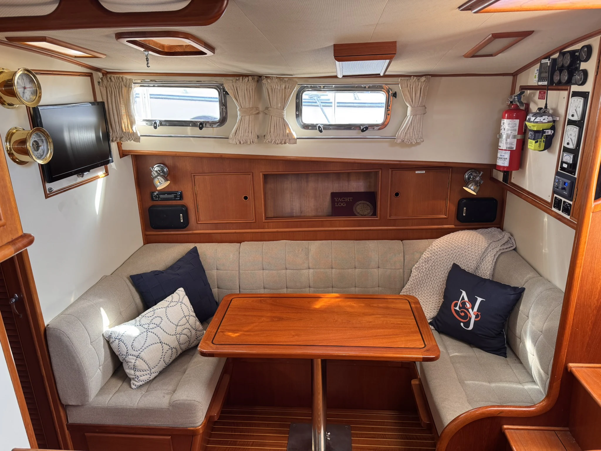 a living room with a couch and a table aboard BALMY Yacht for Sale