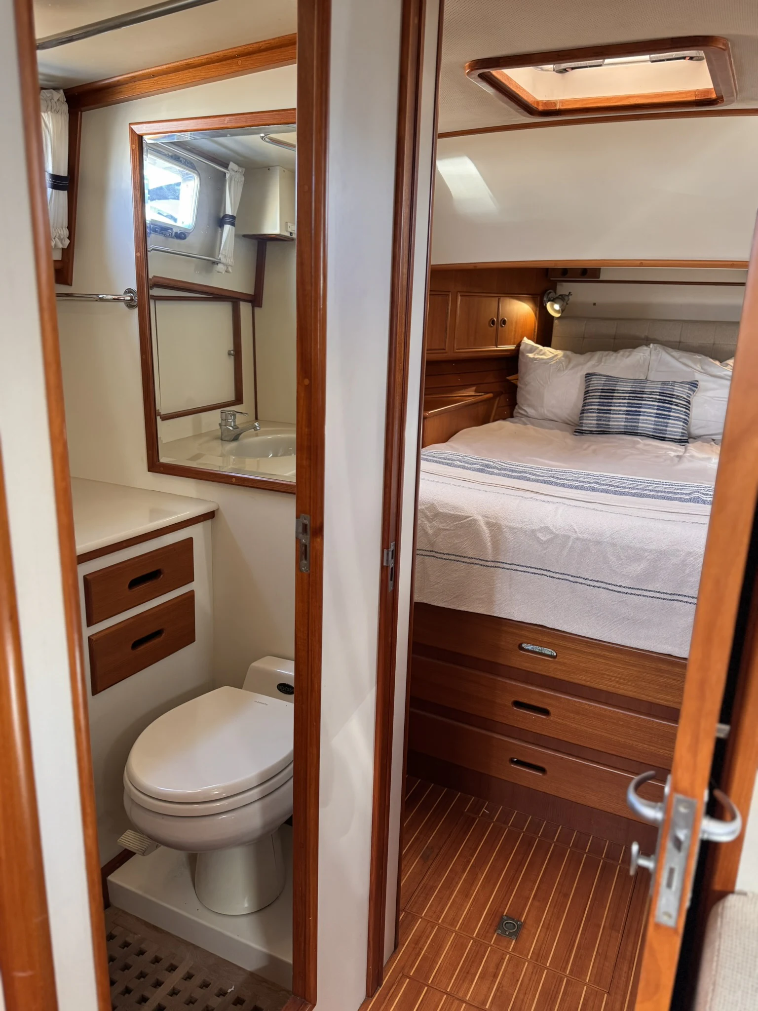 a bathroom with a toilet and a mirror aboard BALMY Yacht for Sale