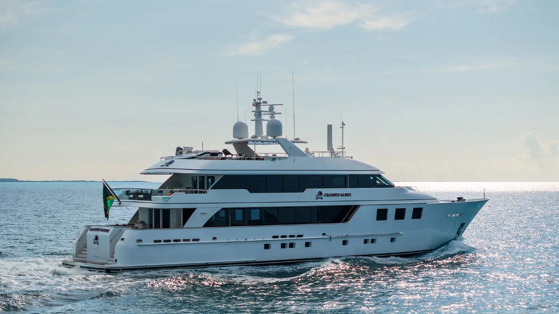 a white boat in the water aboard CROSSED SABRE Yacht for Charter