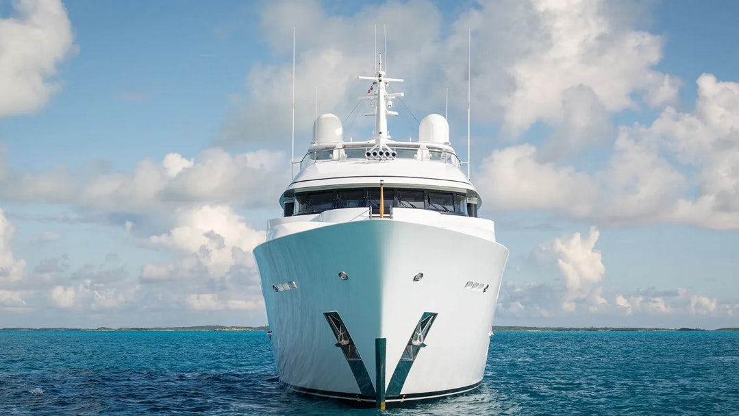 a white boat in the water aboard CROSSED SABRE Yacht for Charter