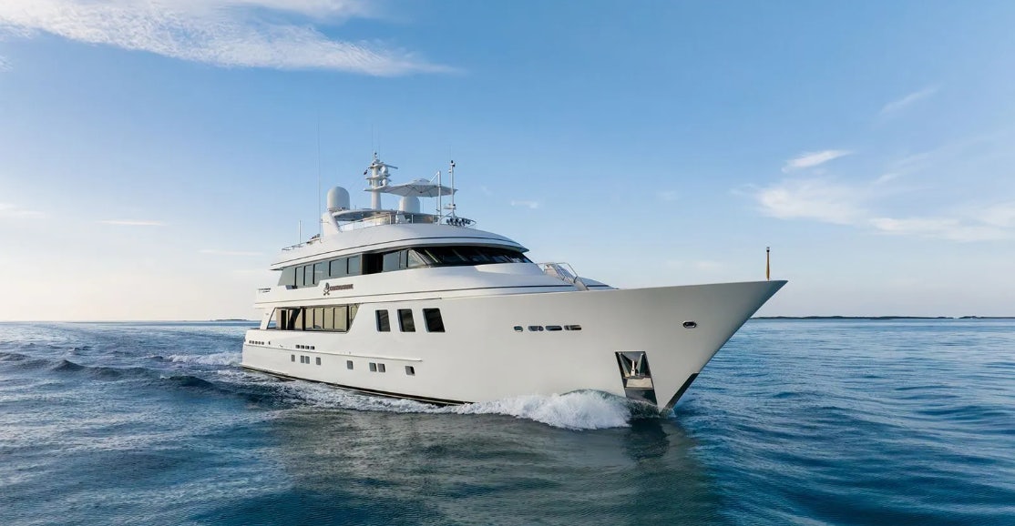 a white boat in the water aboard CROSSED SABRE Yacht for Charter