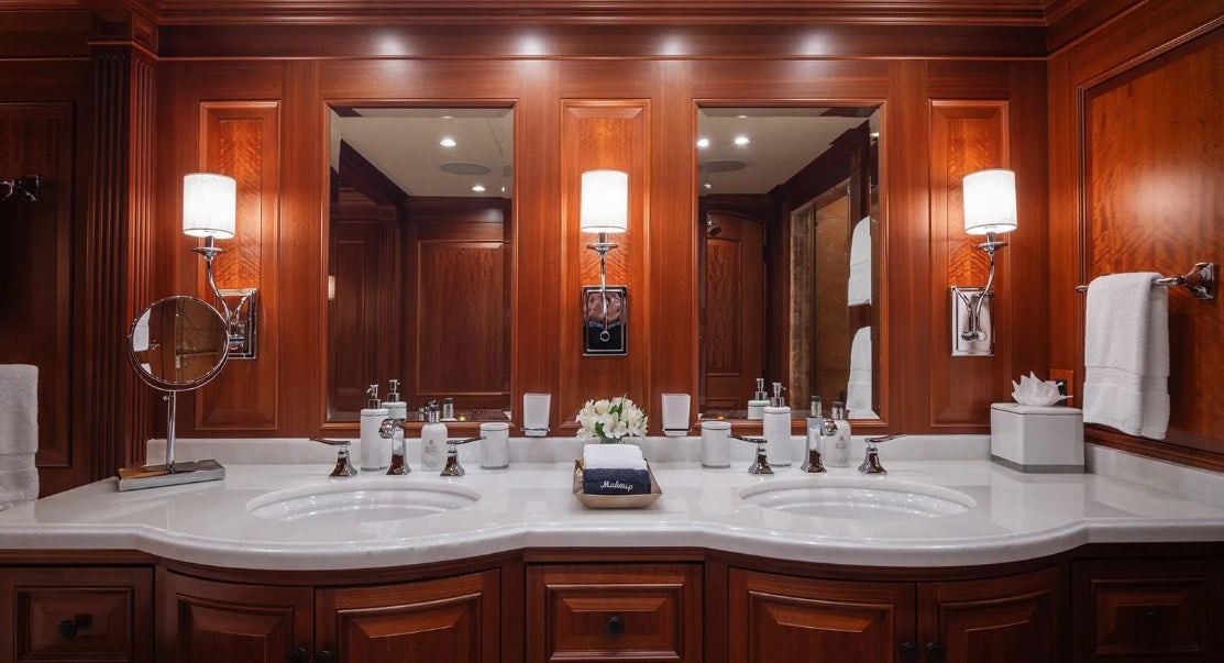 a bathroom with a large mirror aboard CROSSED SABRE Yacht for Charter