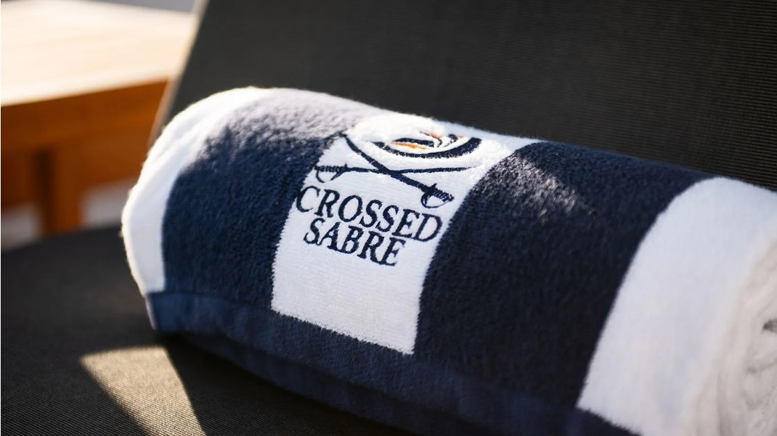 a blue and white pillow aboard CROSSED SABRE Yacht for Charter