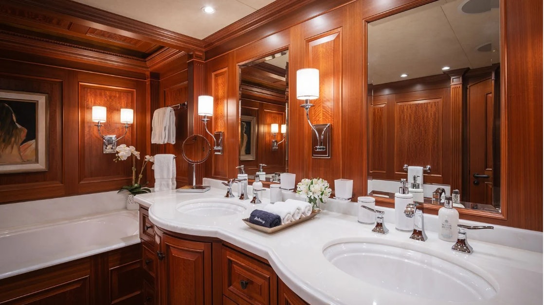 a bathroom with a large mirror aboard CROSSED SABRE Yacht for Charter