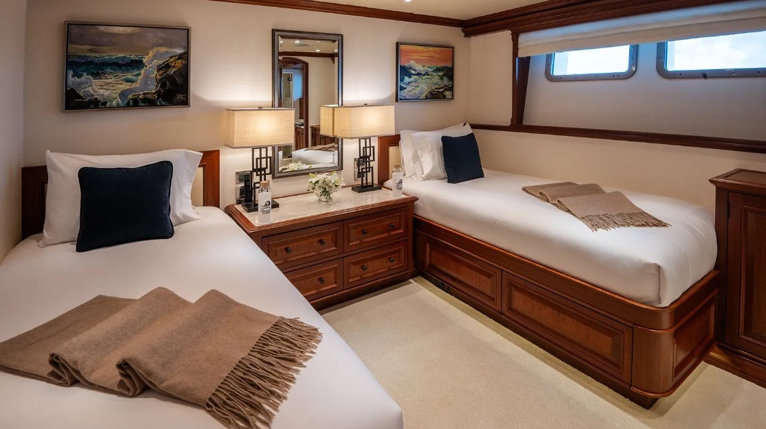 a hotel room with two beds aboard CROSSED SABRE Yacht for Charter
