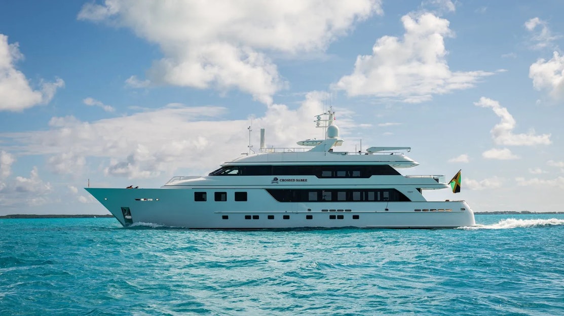 a white boat in the water aboard CROSSED SABRE Yacht for Charter