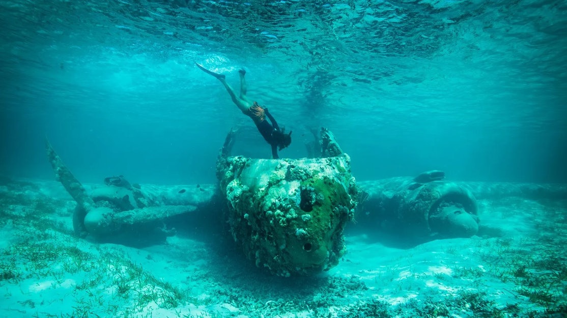 a person swimming in the water aboard CROSSED SABRE Yacht for Charter
