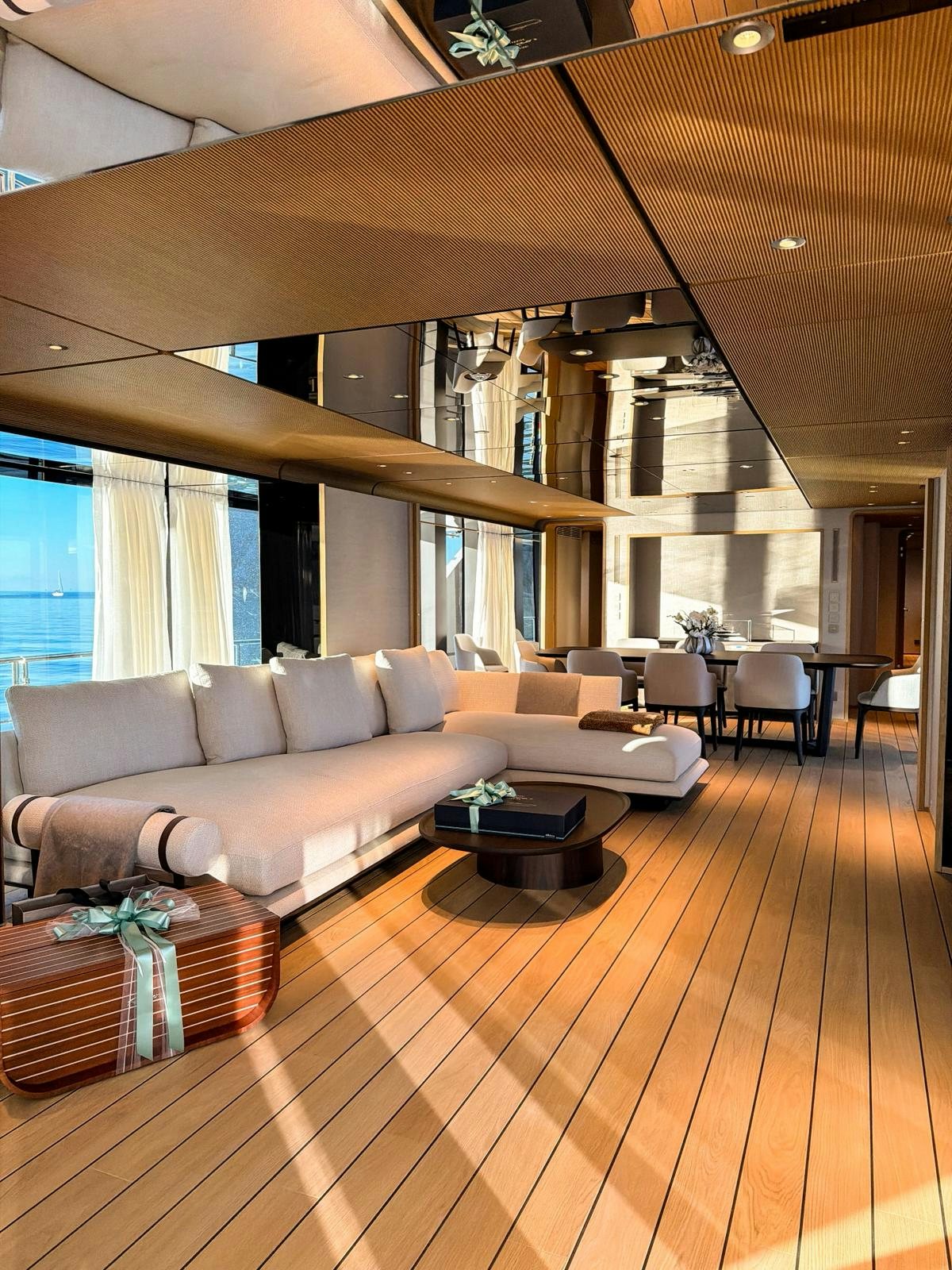 a living room with a wood floor aboard LA VETTA Yacht for Sale