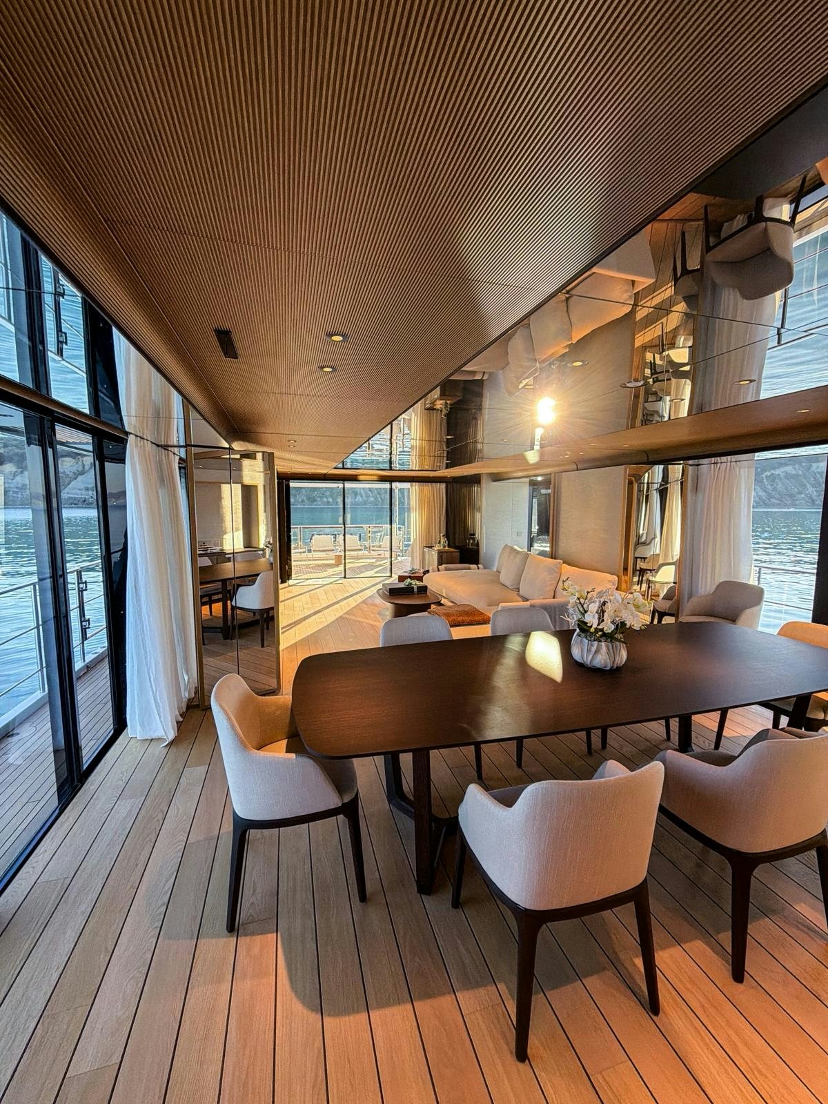 a large dining table in a room aboard LA VETTA Yacht for Sale