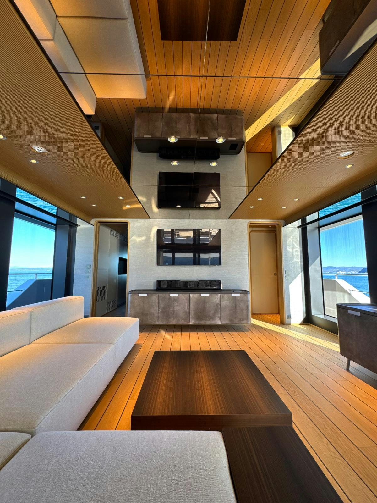 a room with wood floors and a wood floor and a large window aboard LA VETTA Yacht for Sale