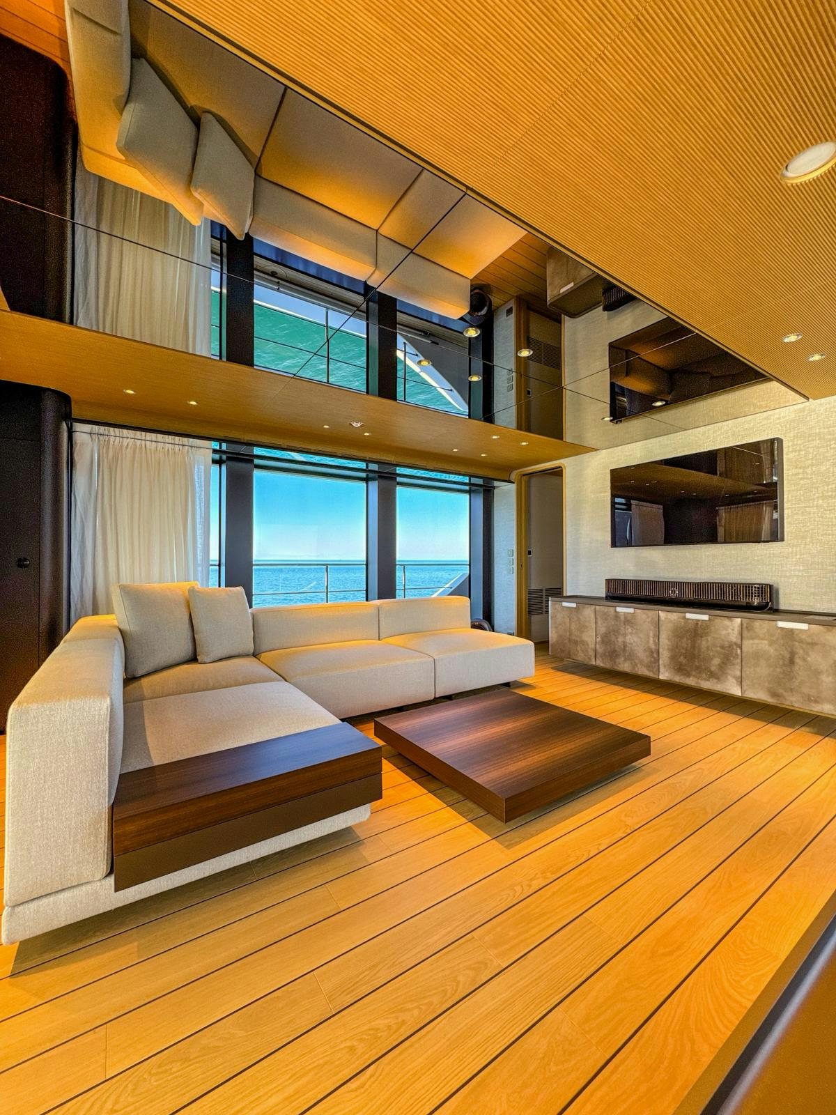 a room with a couch and a fireplace aboard LA VETTA Yacht for Sale