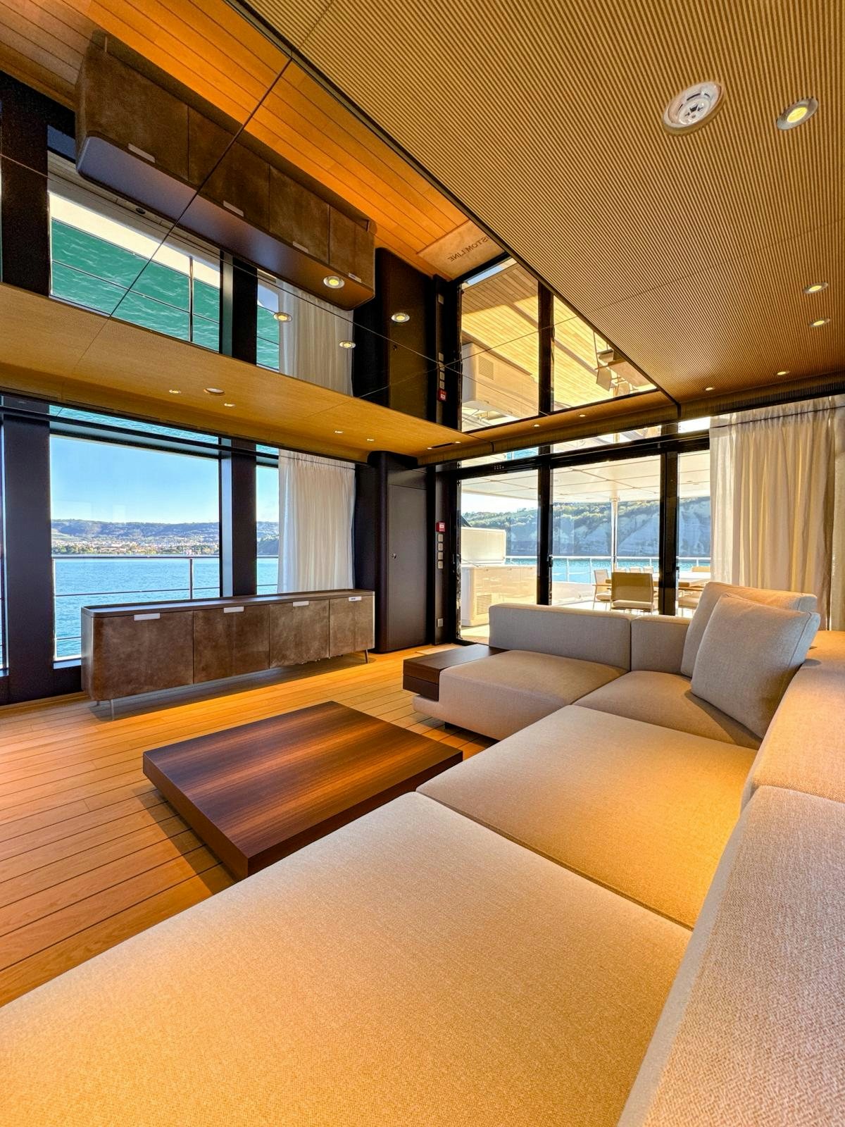 a living room with a large window aboard LA VETTA Yacht for Sale