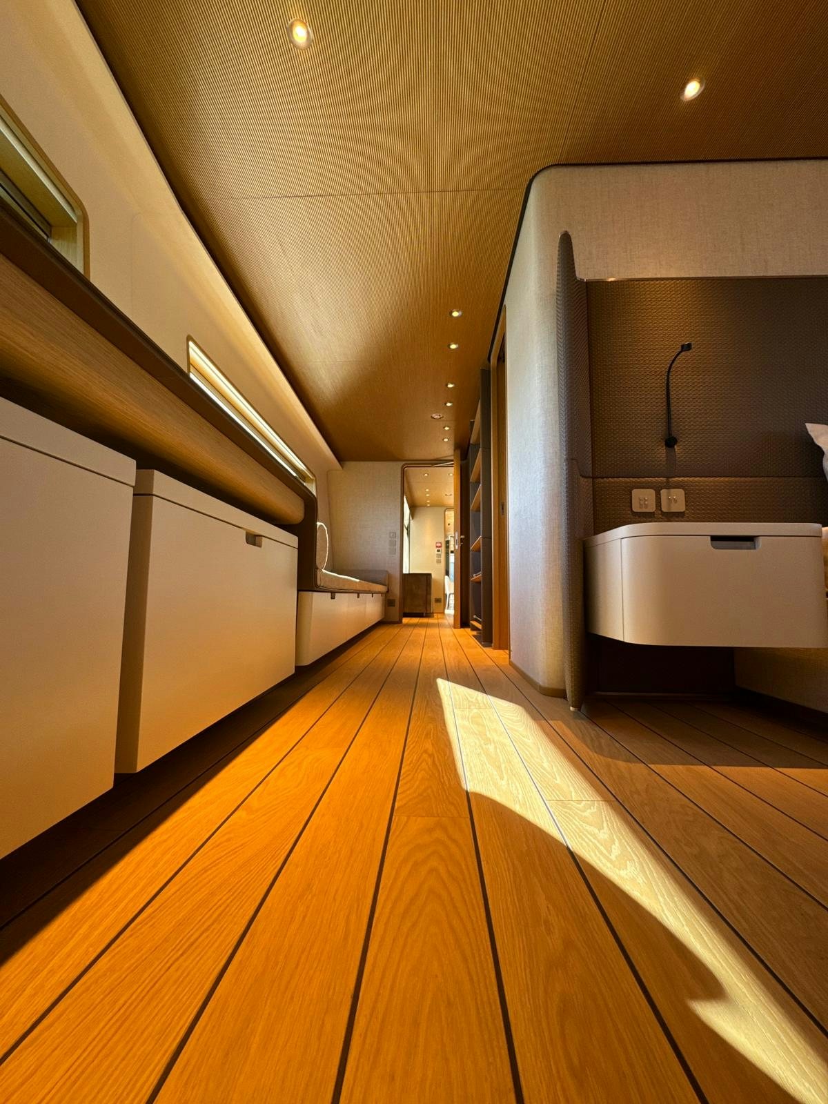 a long wooden hallway aboard LA VETTA Yacht for Sale