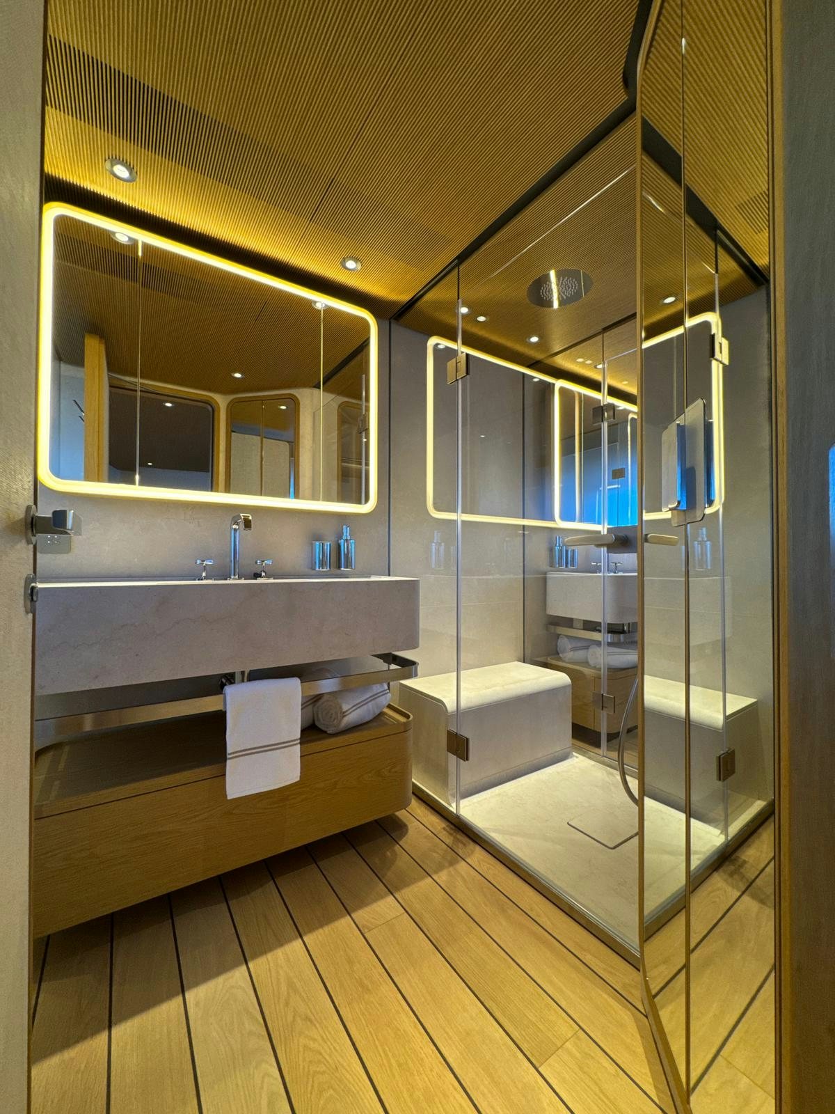 a bathroom with a glass shower aboard LA VETTA Yacht for Sale