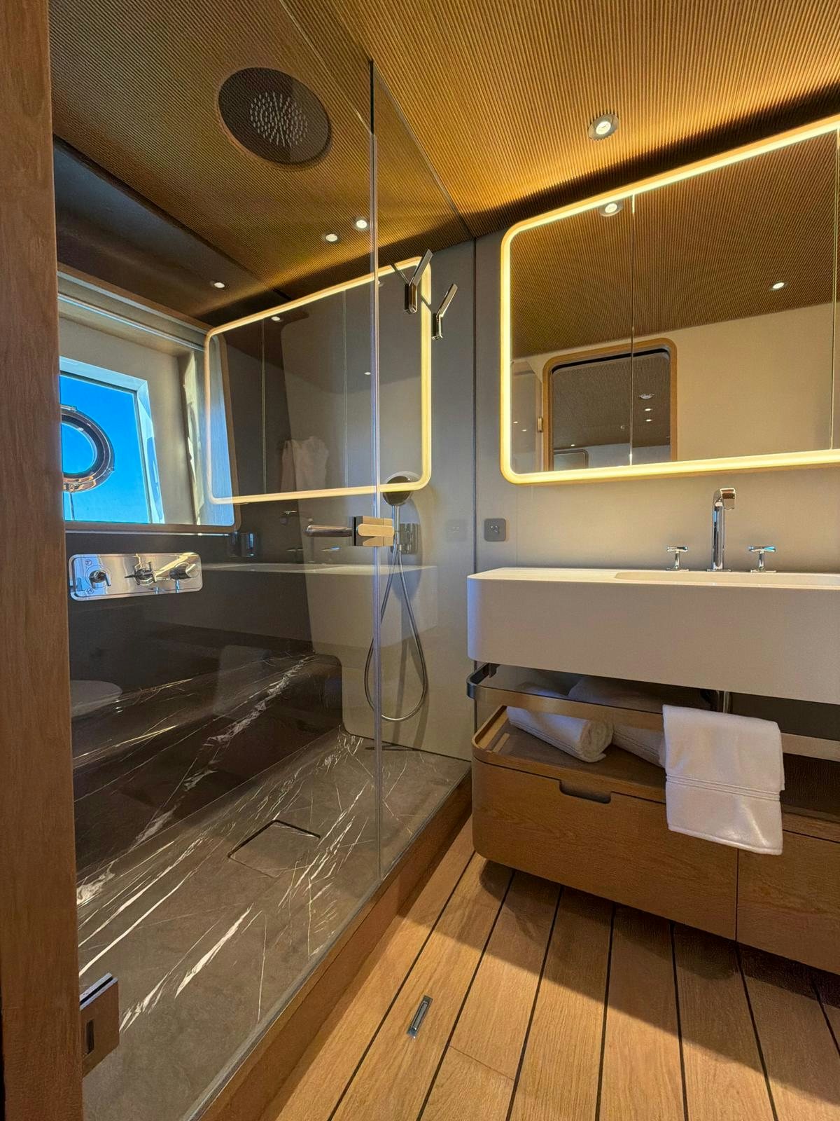 a bathroom with a large mirror aboard LA VETTA Yacht for Sale