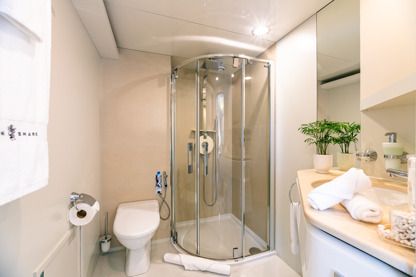 a bathroom with a glass shower aboard KARTAL YUVASI Yacht for Charter