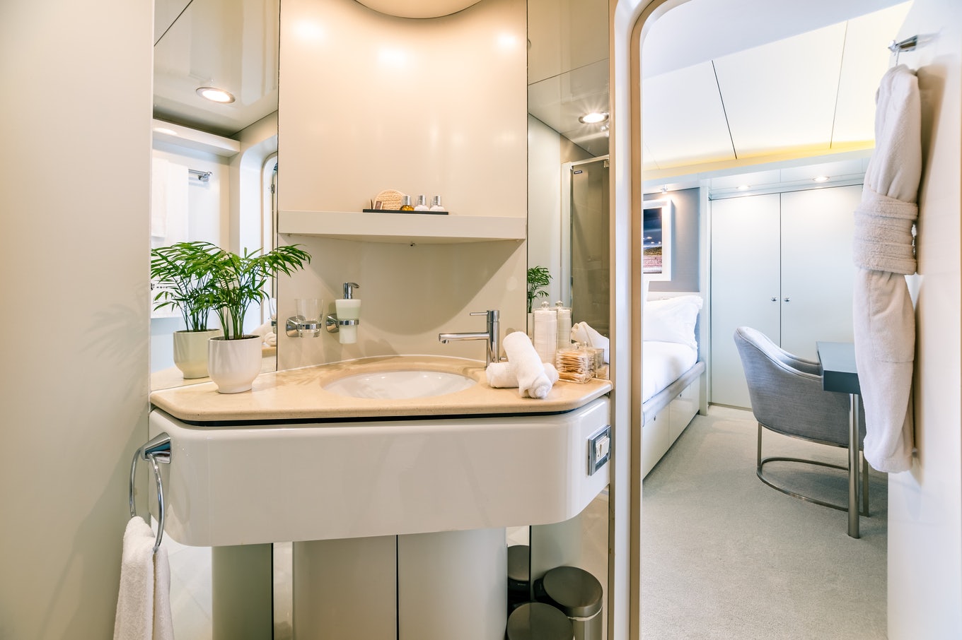 a bathroom with a sink and a chair aboard KARTAL YUVASI Yacht for Charter