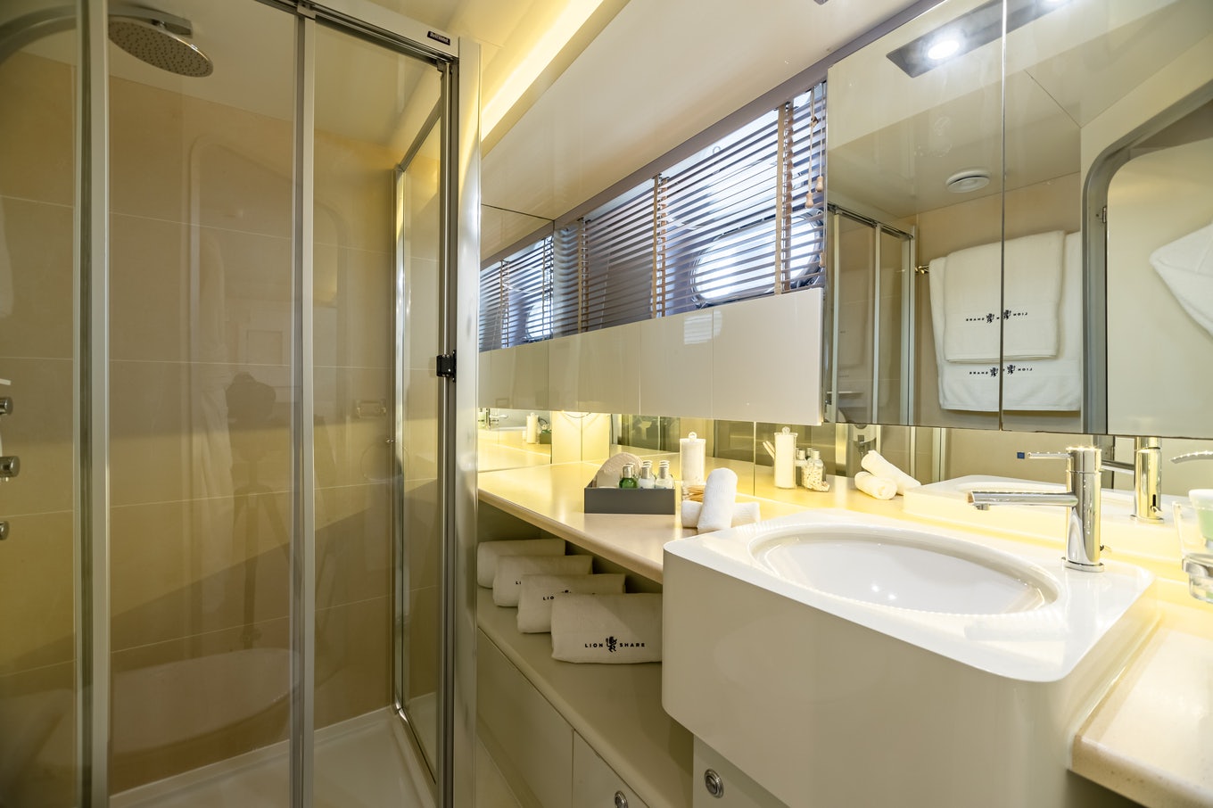 a bathroom with a glass shower aboard KARTAL YUVASI Yacht for Charter