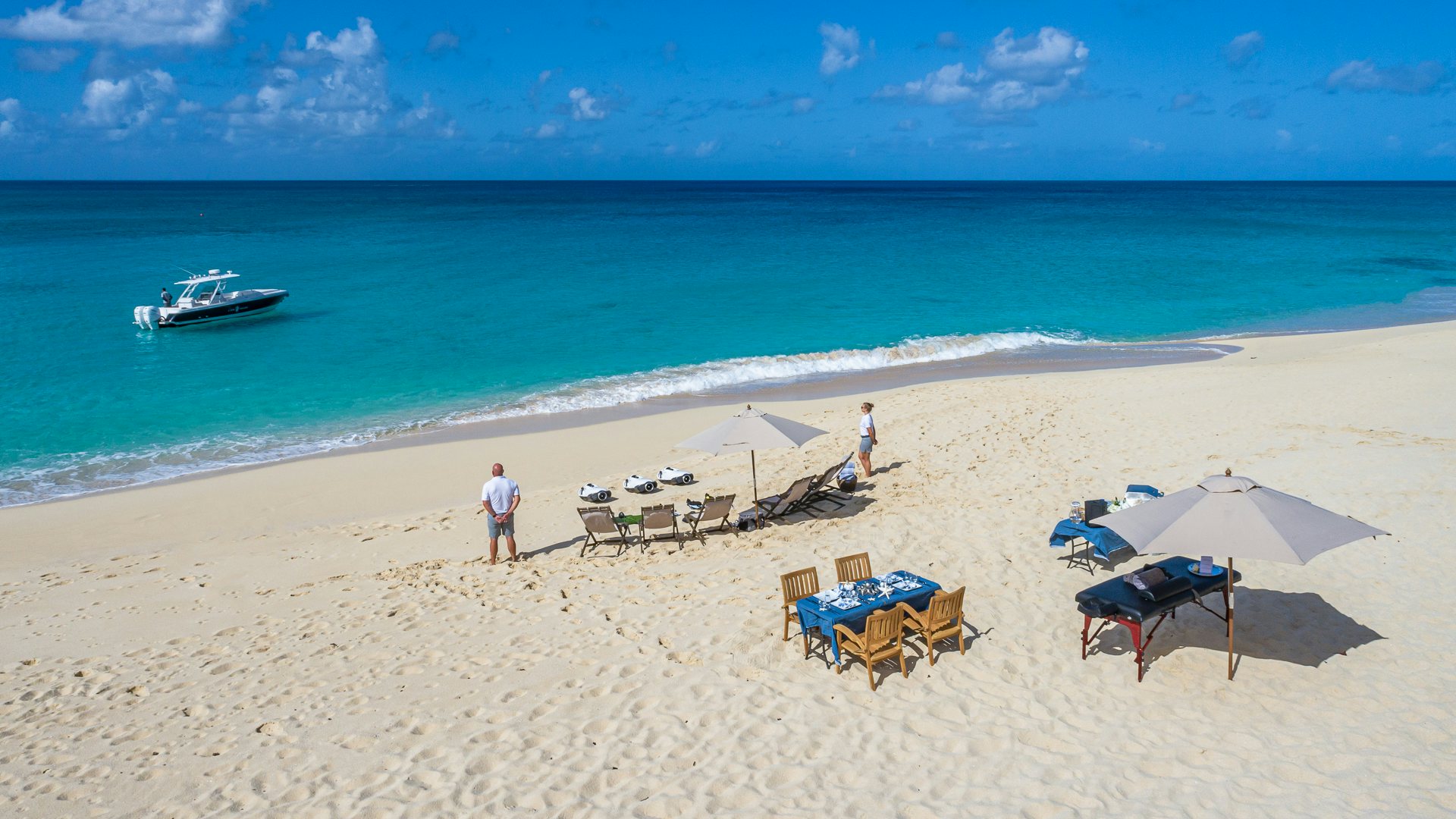 a person standing on a beach aboard KARTAL YUVASI Yacht for Charter