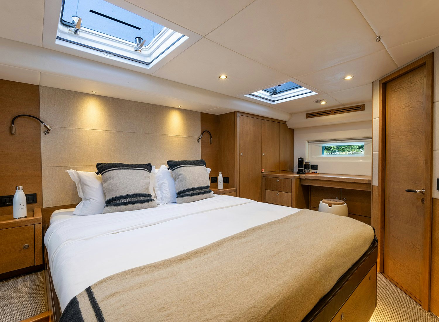 a large bed in a room aboard CHAMPAGNE HIPPY Yacht for Sale