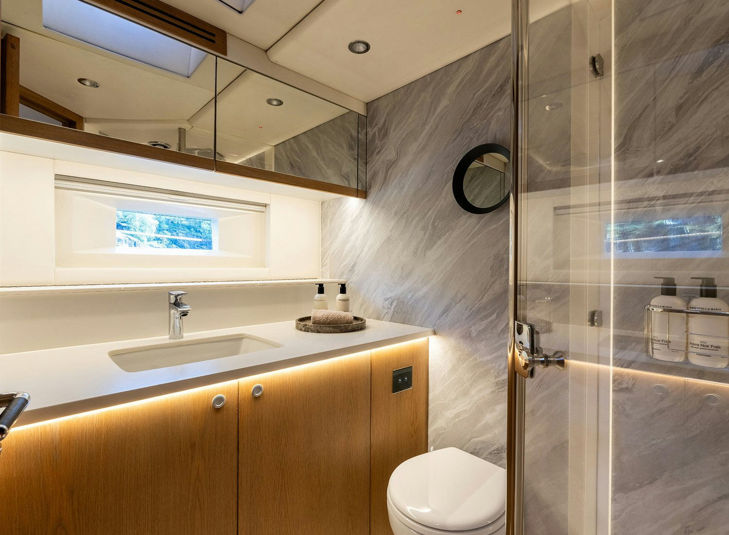 a bathroom with a glass shower aboard CHAMPAGNE HIPPY Yacht for Sale