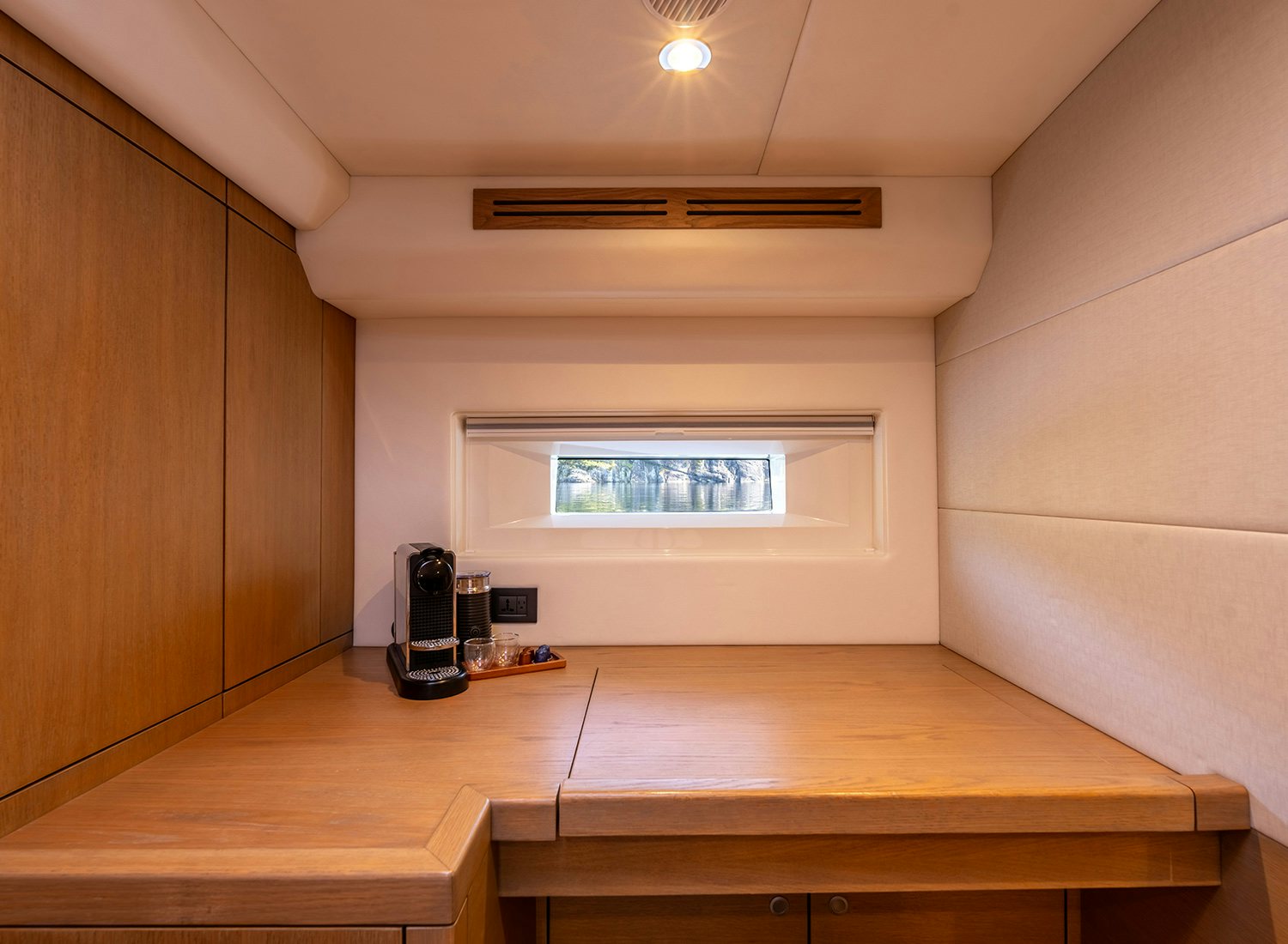 a room with a wood floor and a large window aboard CHAMPAGNE HIPPY Yacht for Sale