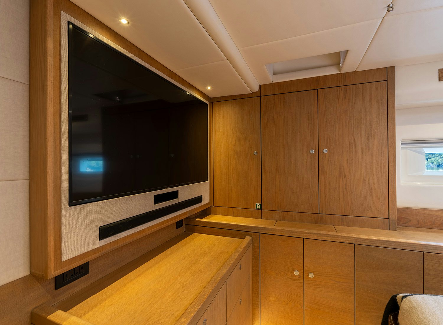 a large tv in a room aboard CHAMPAGNE HIPPY Yacht for Sale