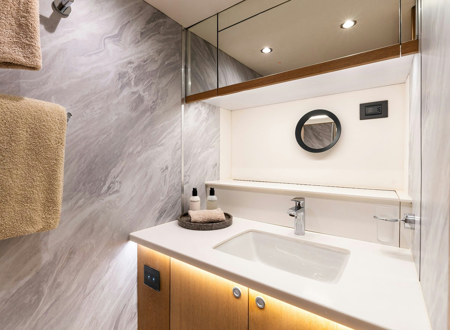 a bathroom with a sink and a mirror aboard CHAMPAGNE HIPPY Yacht for Sale