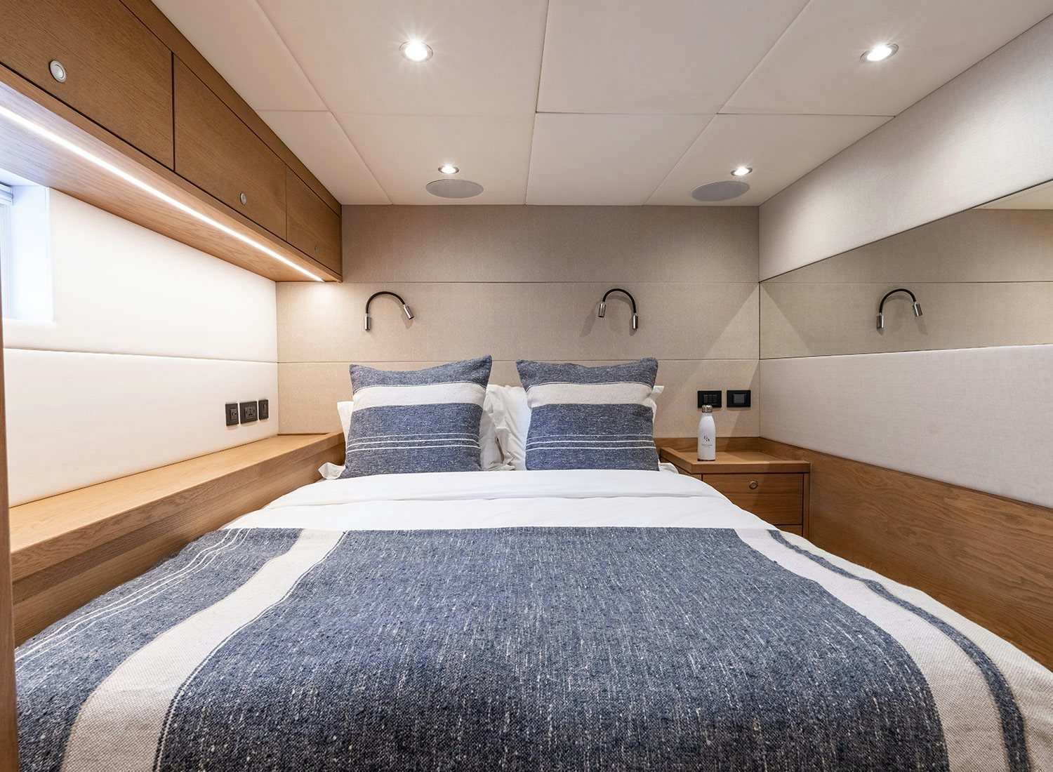 a large bed in a room aboard CHAMPAGNE HIPPY Yacht for Sale