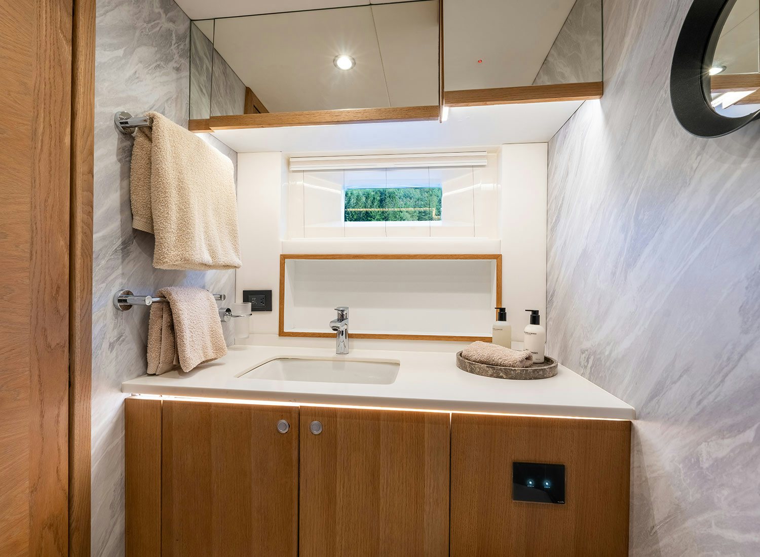 a bathroom with a sink and a mirror aboard CHAMPAGNE HIPPY Yacht for Sale