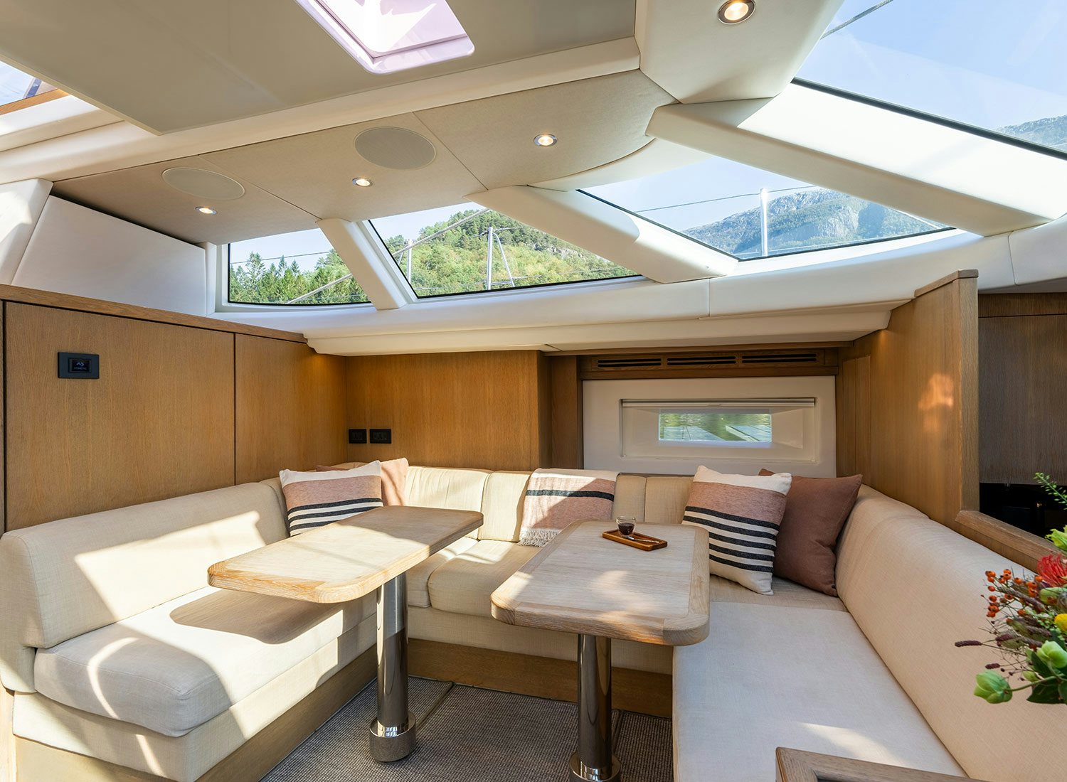a room with a couch and a table aboard CHAMPAGNE HIPPY Yacht for Sale