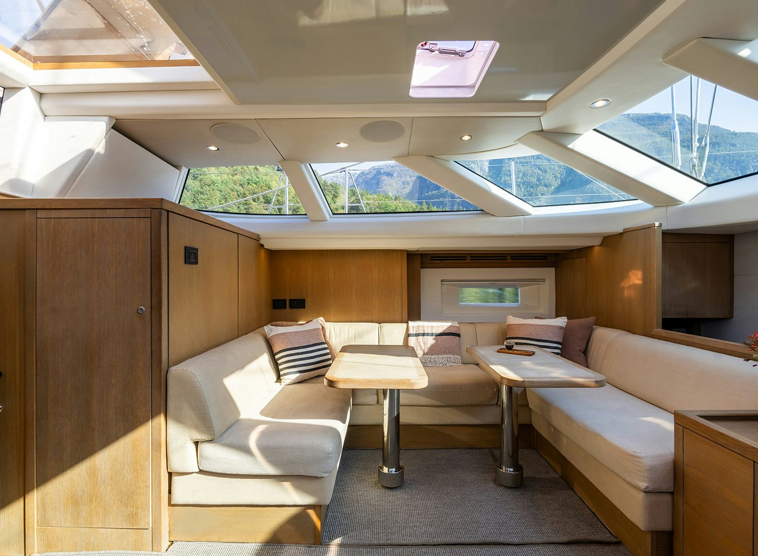 a room with couches and a table aboard CHAMPAGNE HIPPY Yacht for Sale