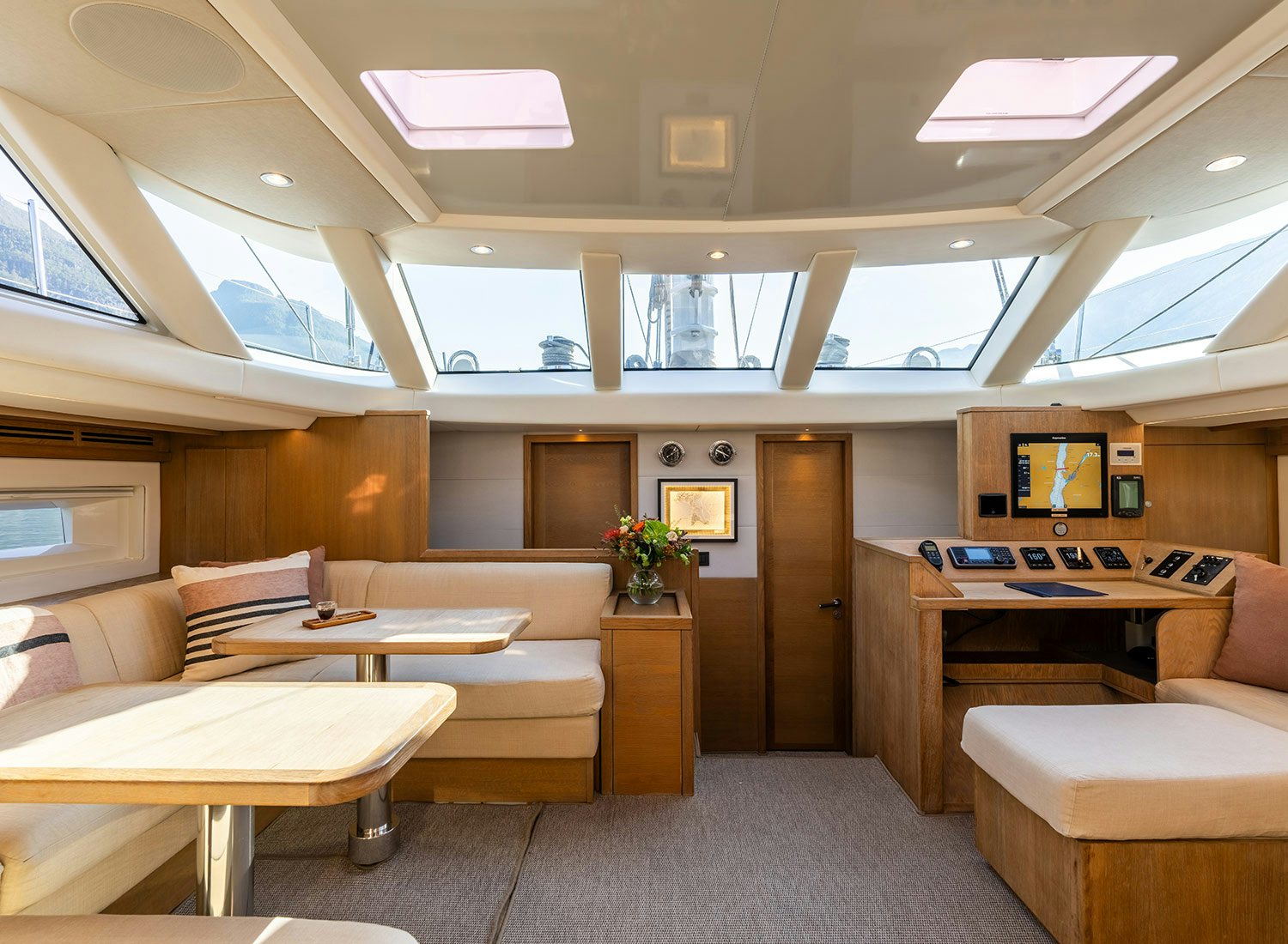 a room with a couch and a table aboard CHAMPAGNE HIPPY Yacht for Sale