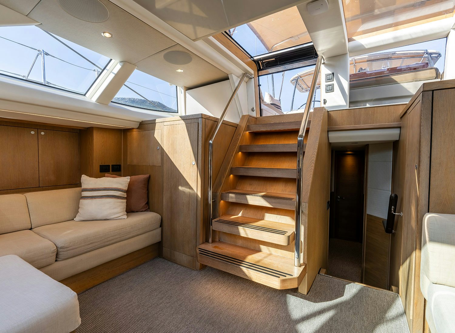 a room with a bed and a couch aboard CHAMPAGNE HIPPY Yacht for Sale