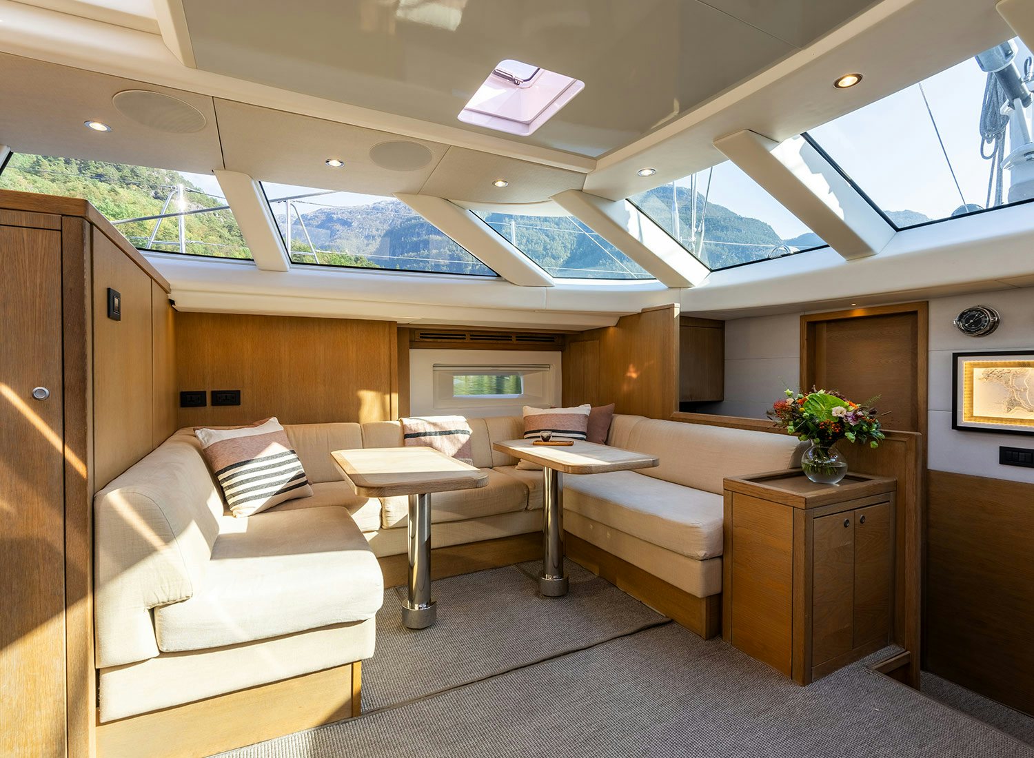 a living room with a couch and a table aboard CHAMPAGNE HIPPY Yacht for Sale