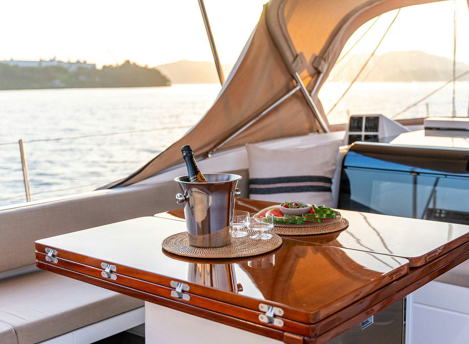 a table with a cup and a tray on it aboard CHAMPAGNE HIPPY Yacht for Sale