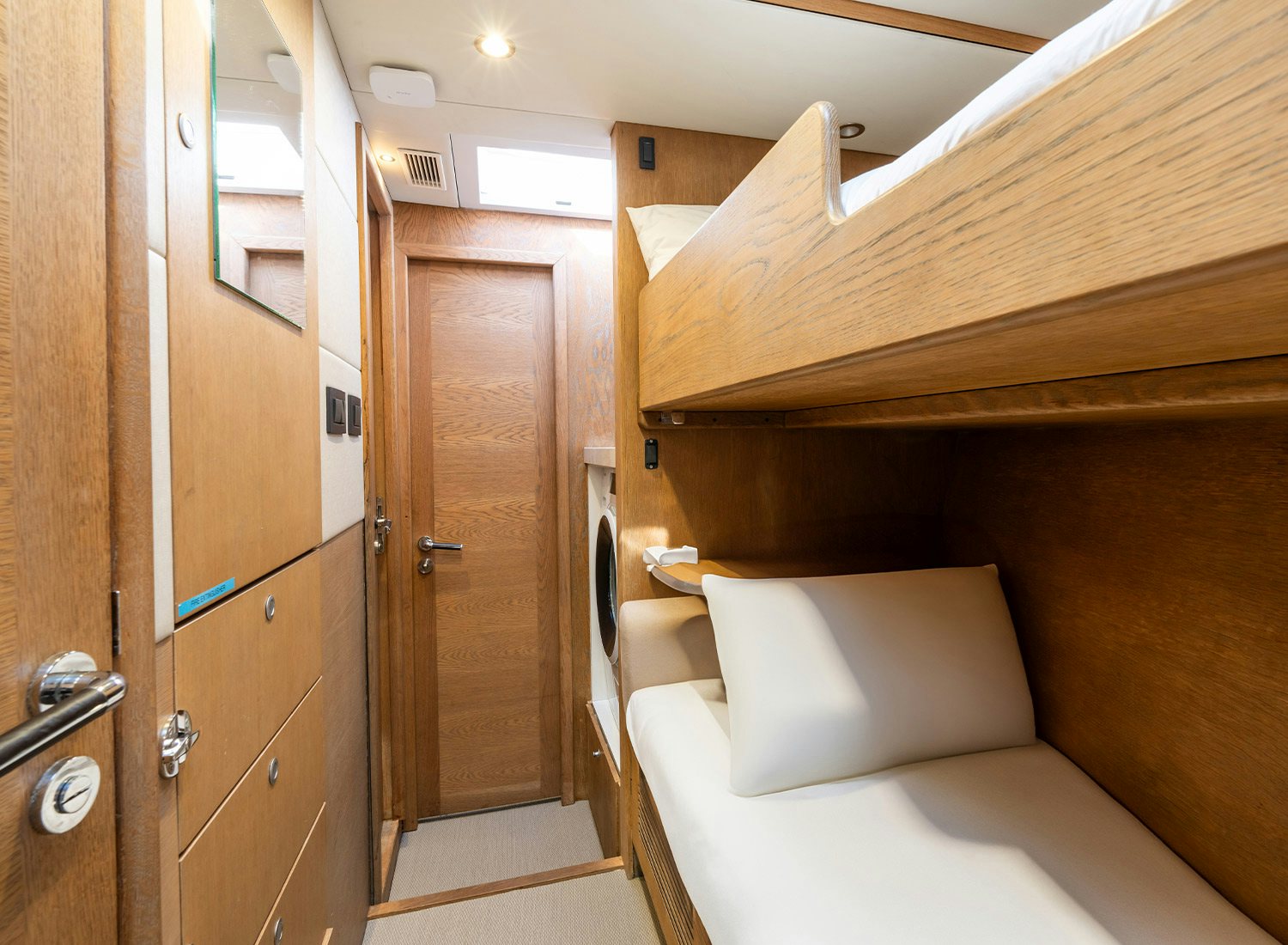 a room with a bed and a door aboard CHAMPAGNE HIPPY Yacht for Sale