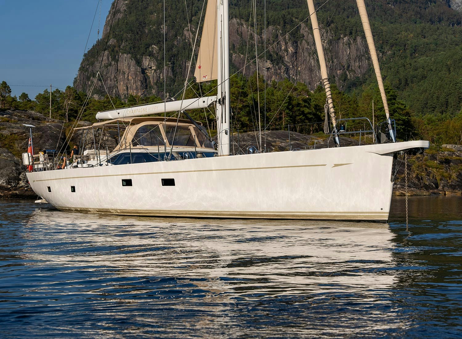 a white boat in the water aboard CHAMPAGNE HIPPY Yacht for Sale