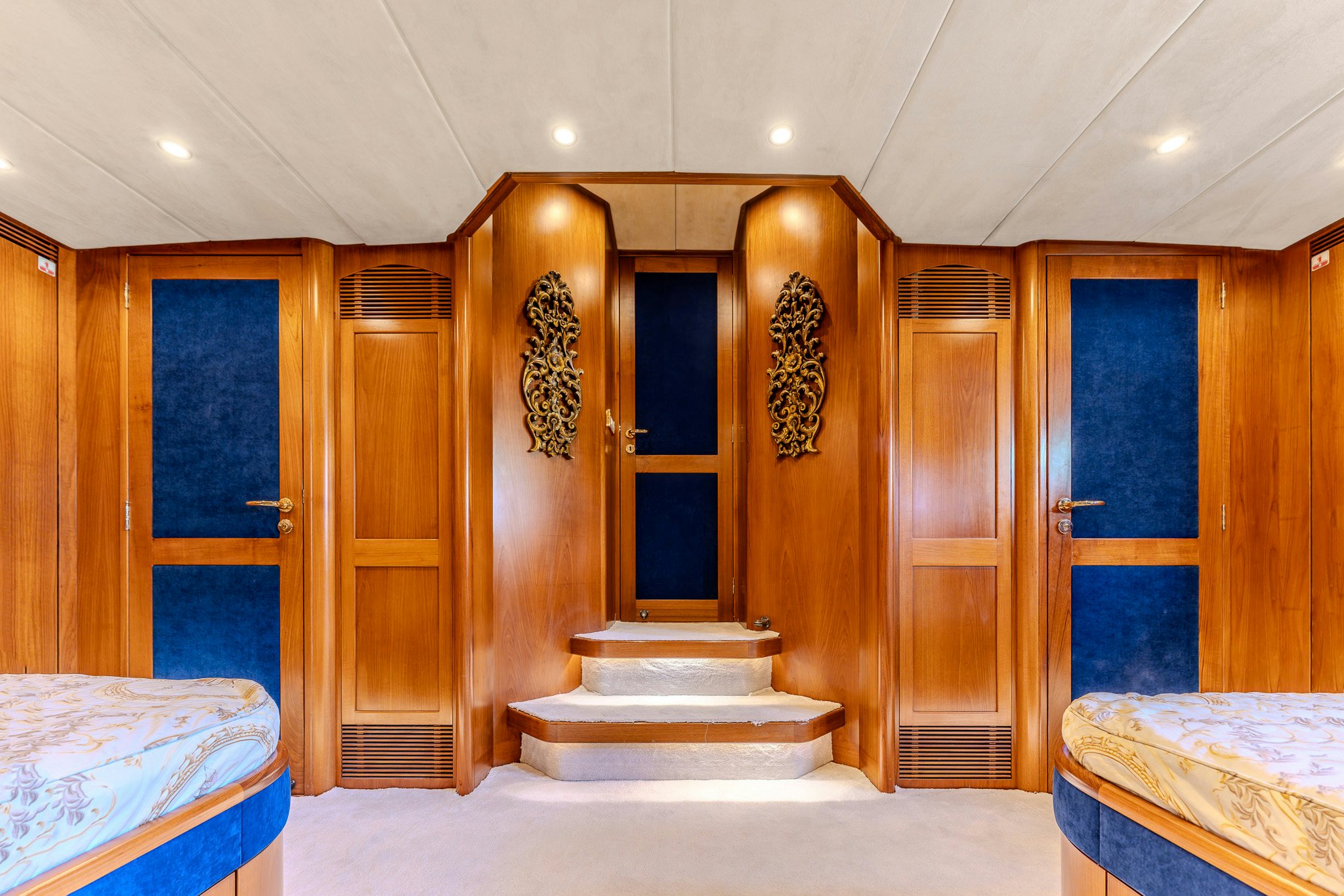 a room with a bed and a door aboard YOSMA Yacht for Sale