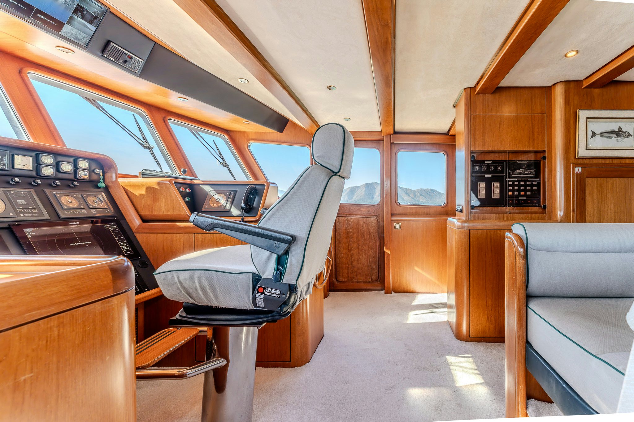 a room with a couch and a piano aboard YOSMA Yacht for Sale