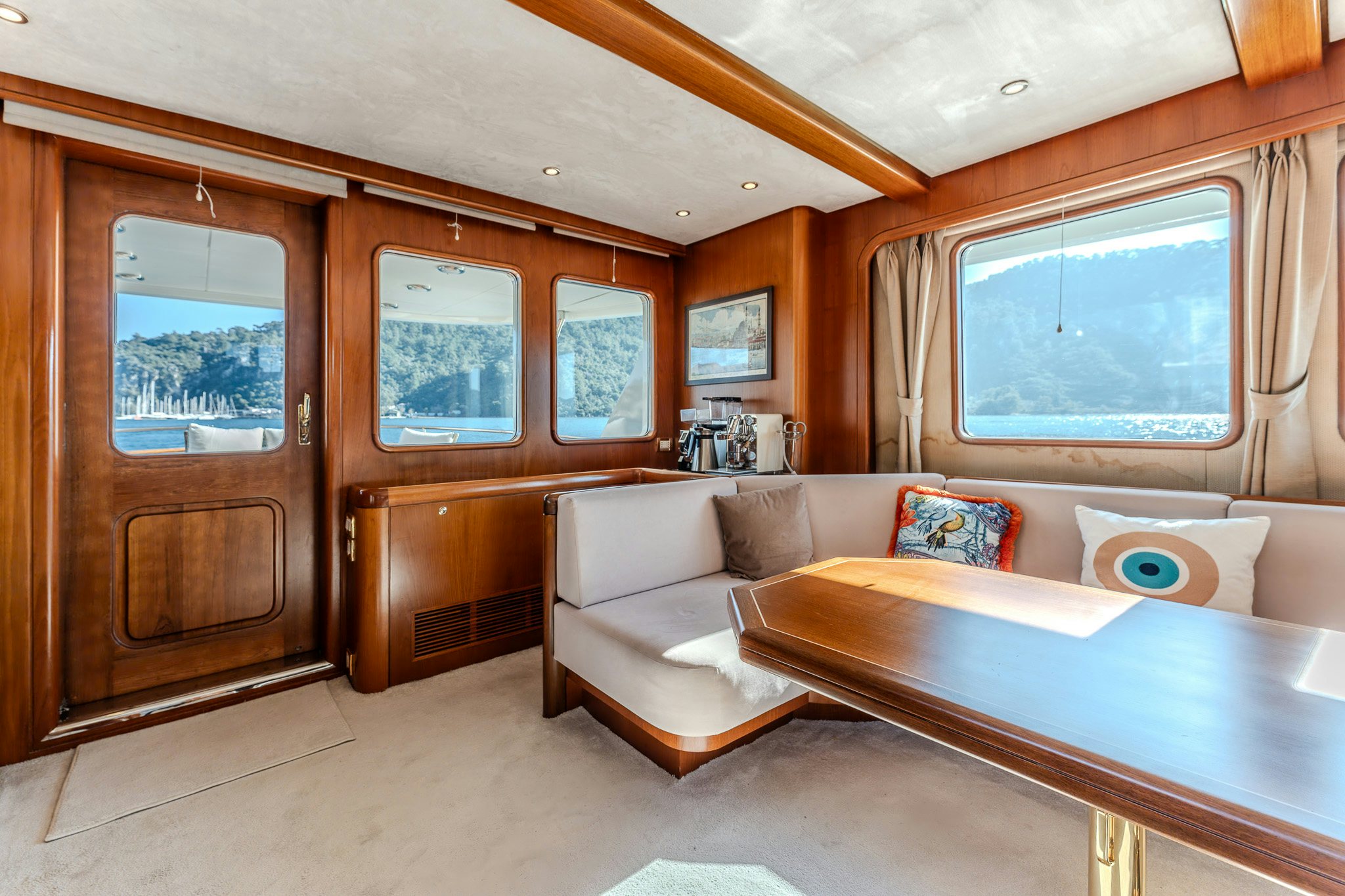 a living room with a couch and a table aboard YOSMA Yacht for Sale
