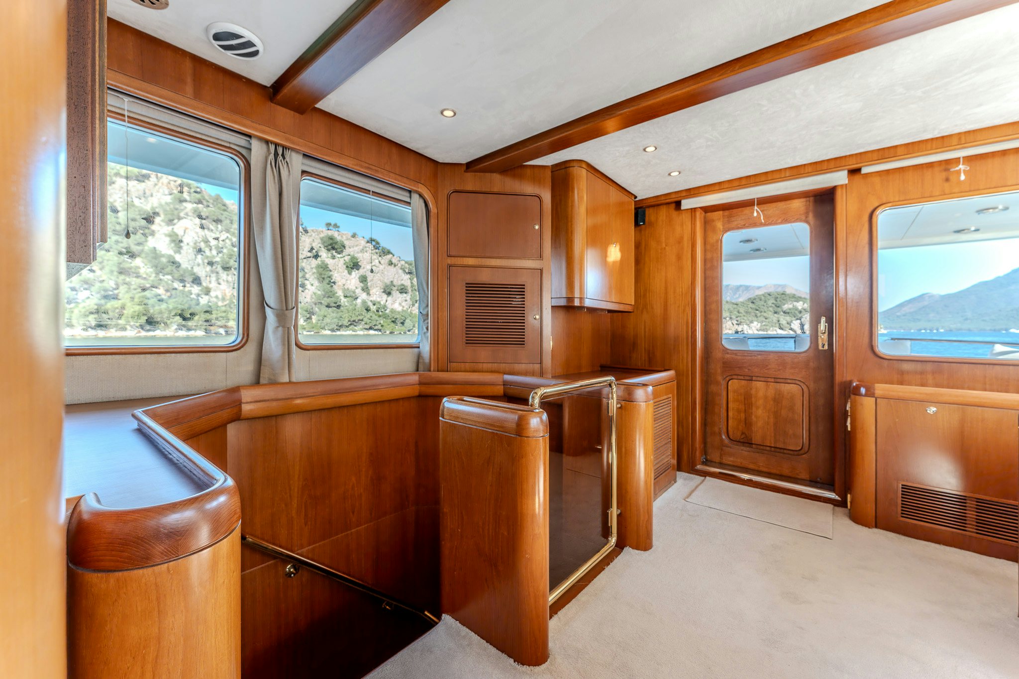 a room with wooden cabinets aboard YOSMA Yacht for Sale