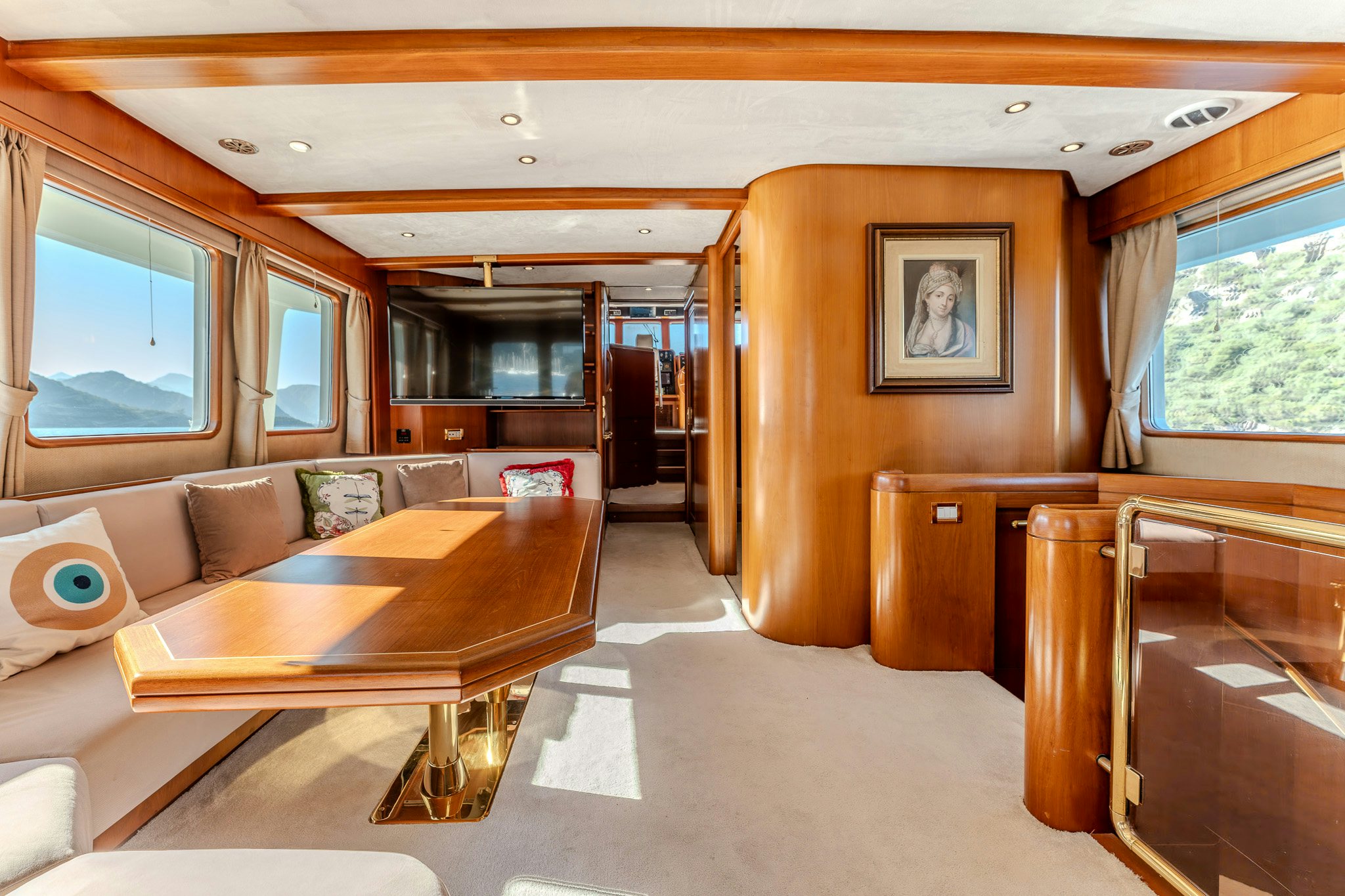a living room with a couch and a table aboard YOSMA Yacht for Sale