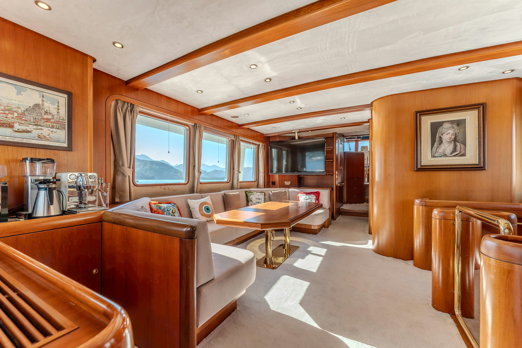 a living room with a couch and a table aboard YOSMA Yacht for Sale