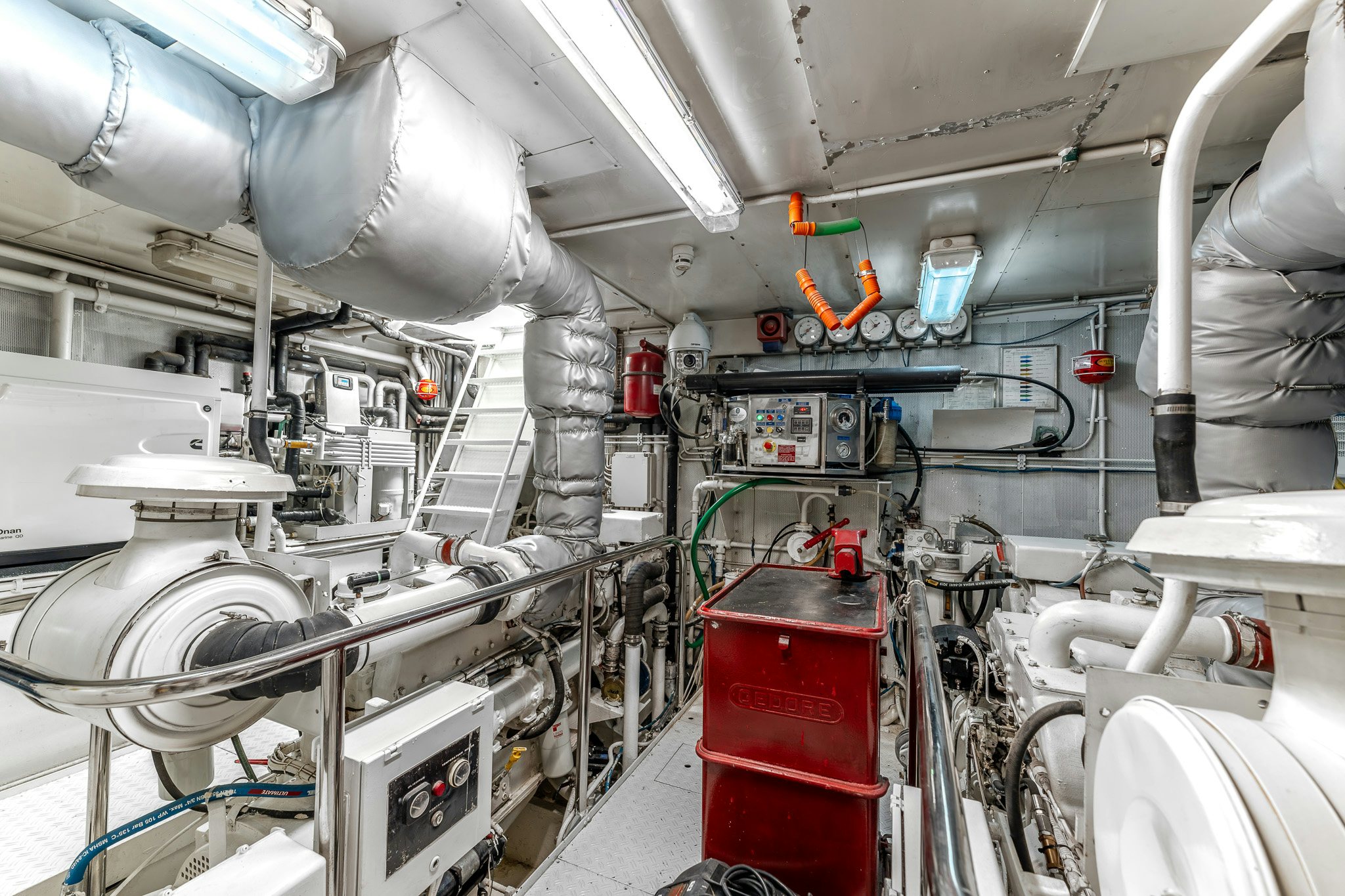 a room with machinery and pipes aboard YOSMA Yacht for Sale