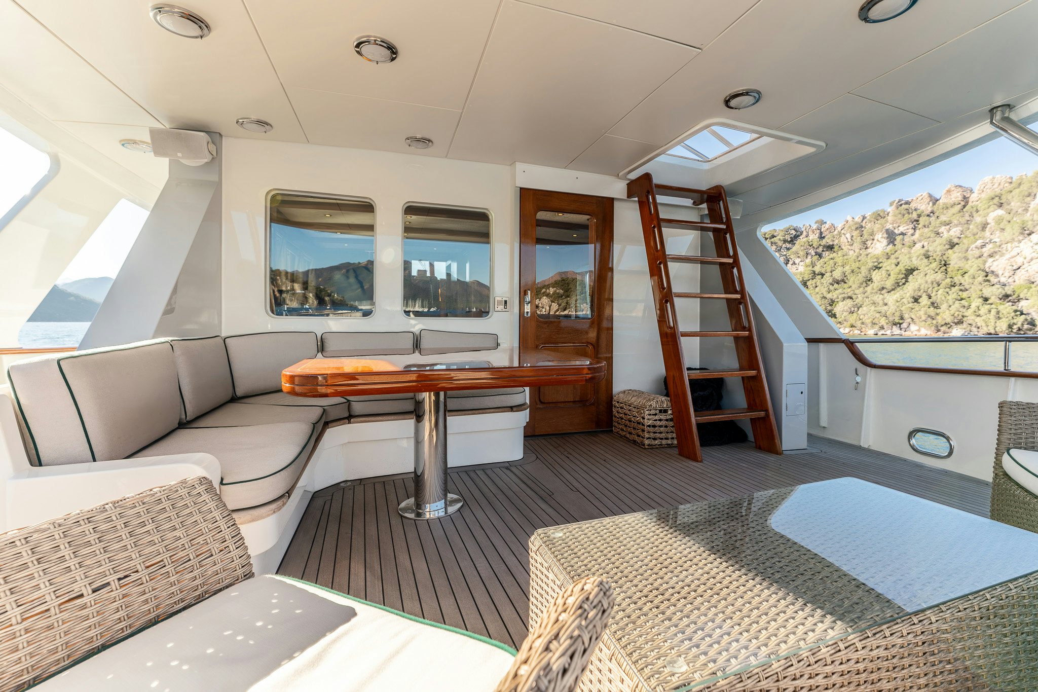 a living room with a large window aboard YOSMA Yacht for Sale