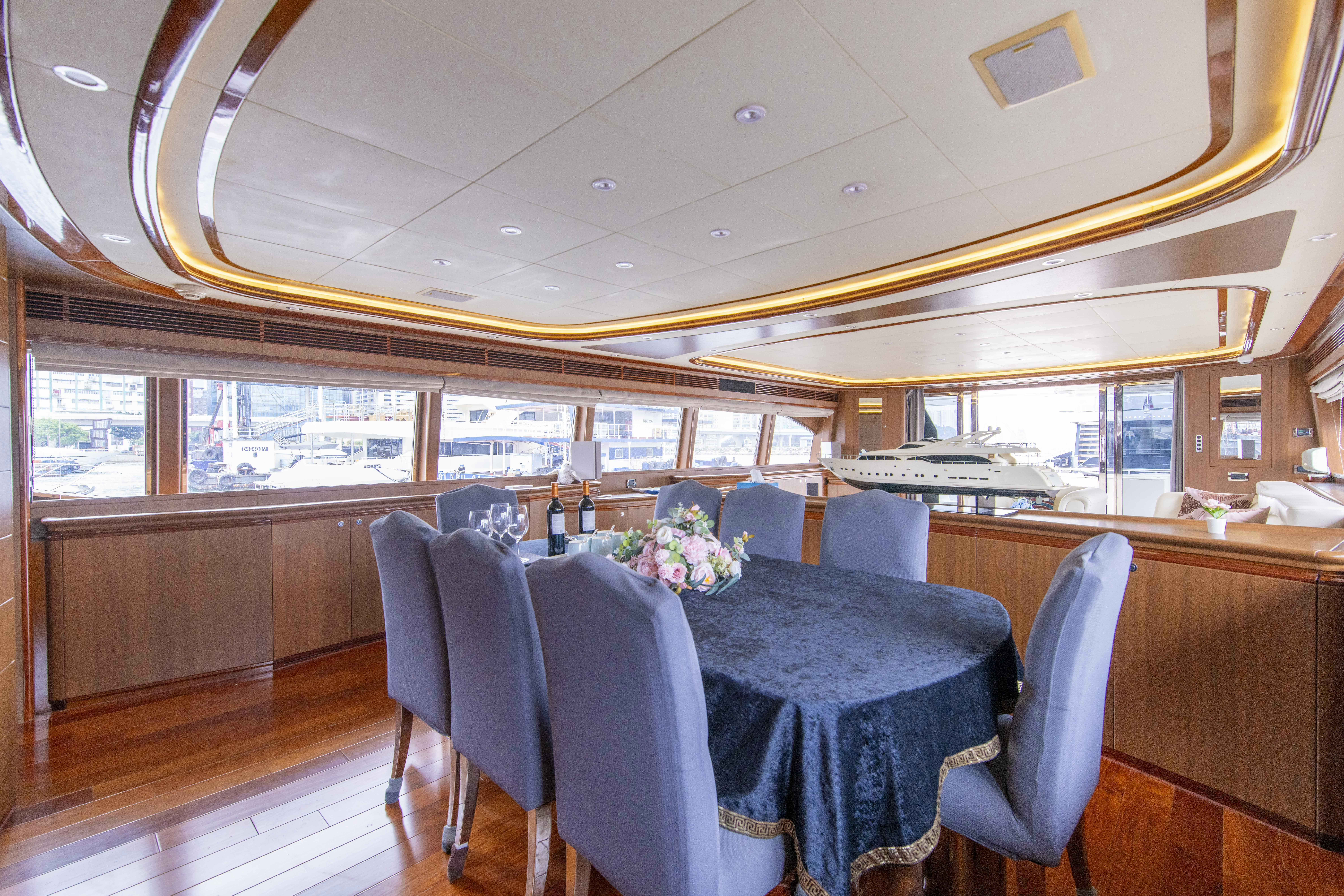 a dining room with a table and chairs aboard PANDORA Yacht for Sale