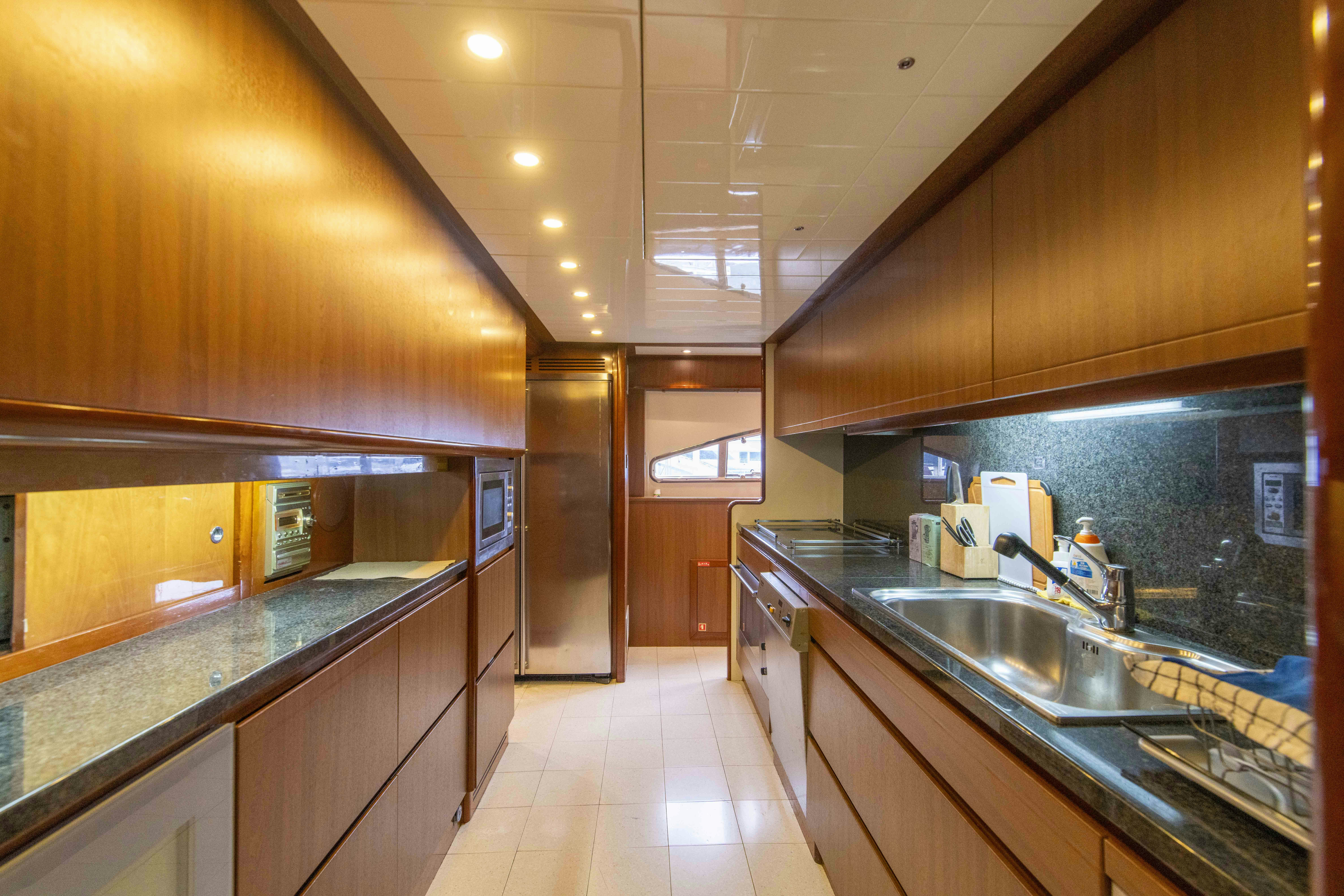 a kitchen with a large island aboard PANDORA Yacht for Sale