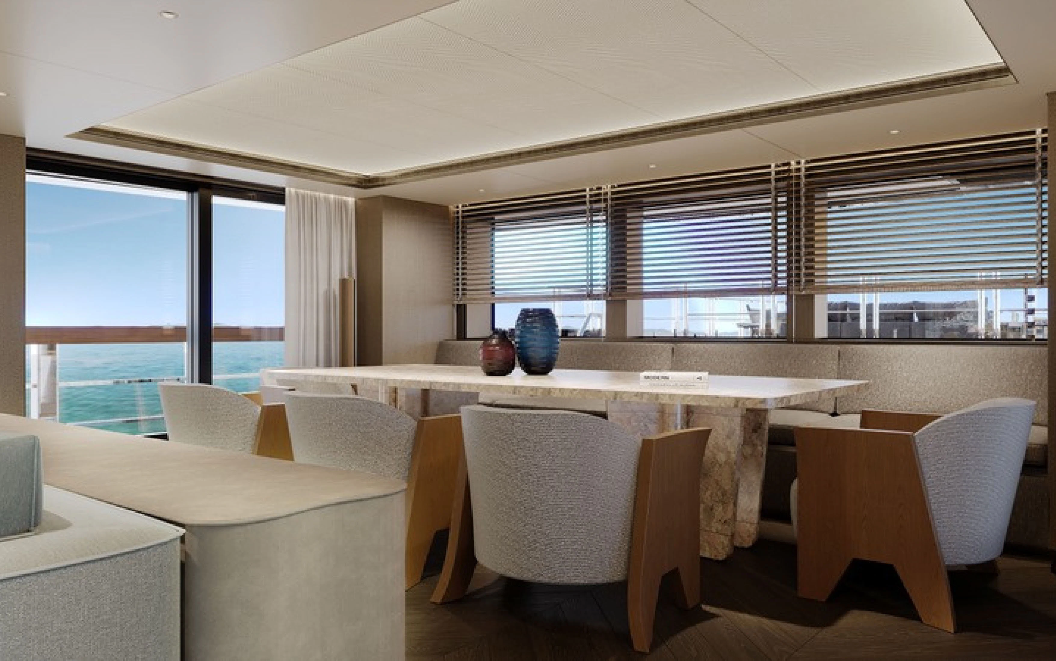 a room with tables and chairs aboard CASA F Yacht for Charter